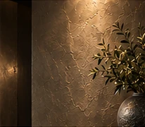 Bronze-toned feature wall under warm accent lighting