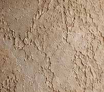 Warm sand plaster with a tactile hand-worked texture